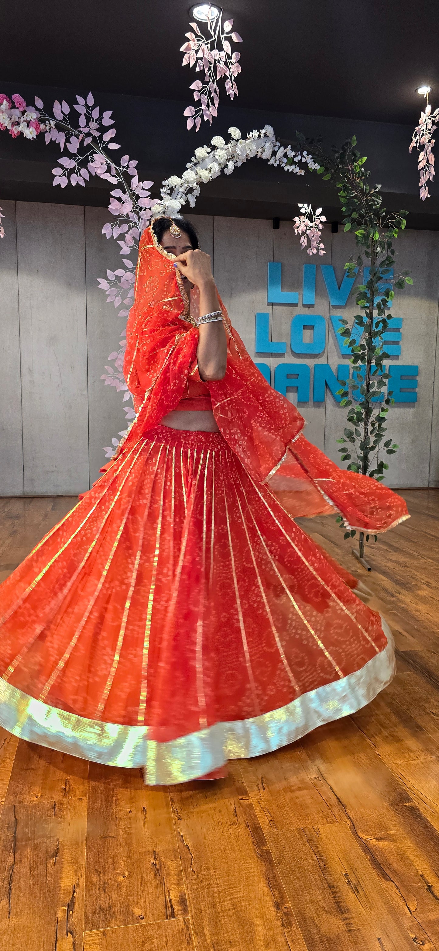 Siddhi Orange Bandhani lehenga