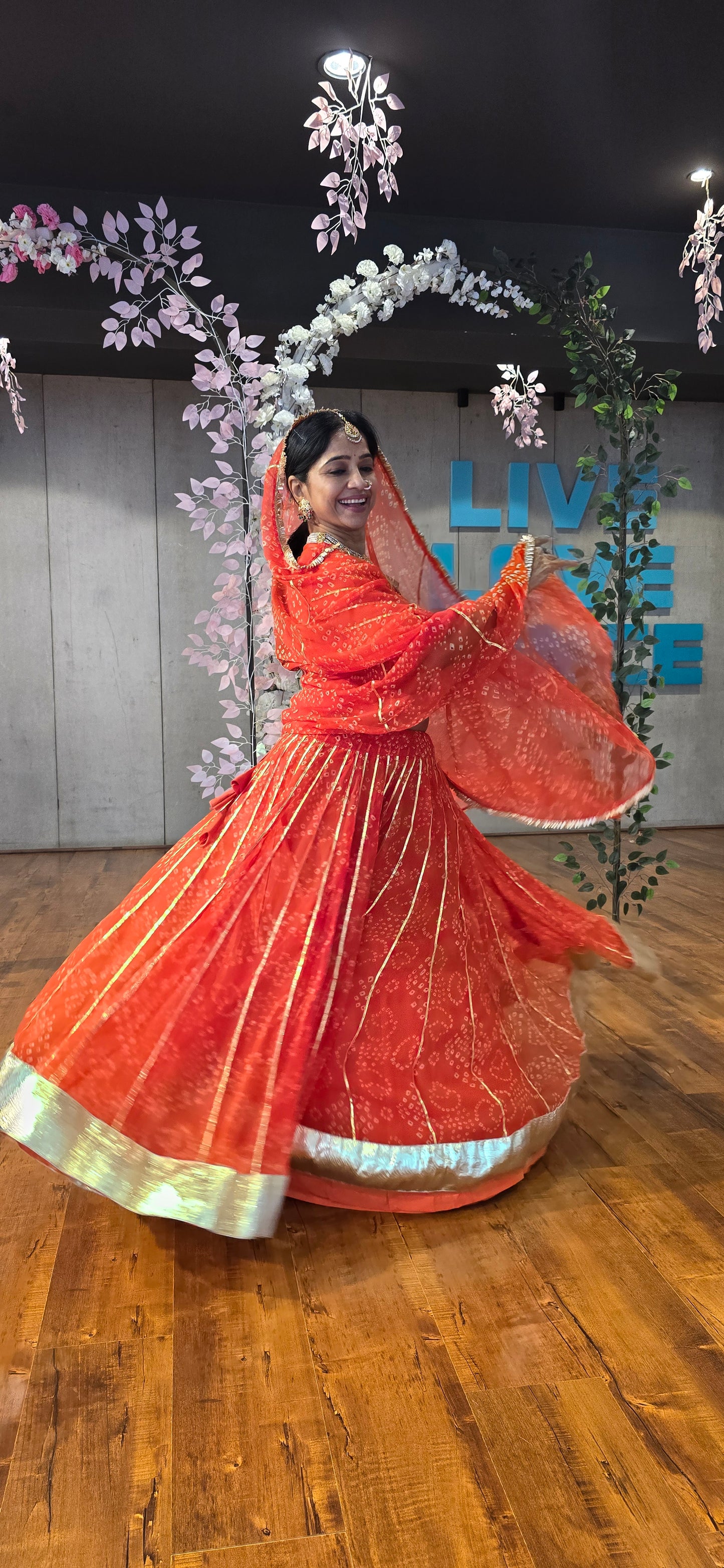 Siddhi Orange Bandhani lehenga
